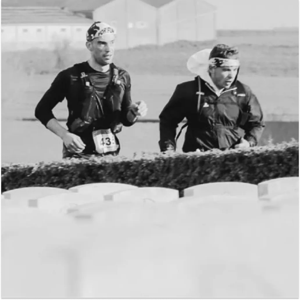 Athletes running in cemetery
